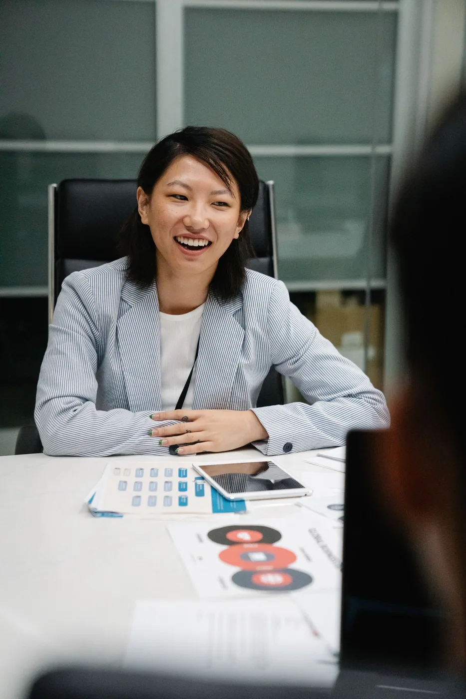 Smiling businesswoman at a desk in an office