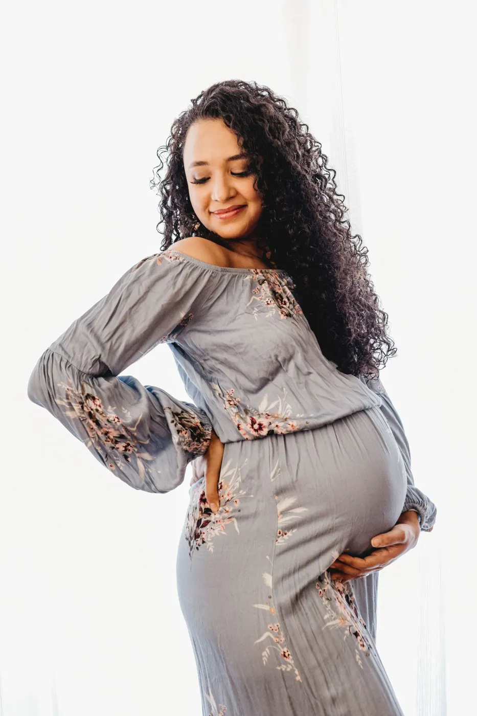 Pregnant woman with curly hair